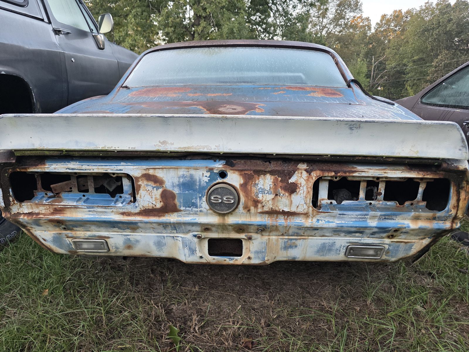 Rusted tail panel of a first-generation Camaro SS before restoration