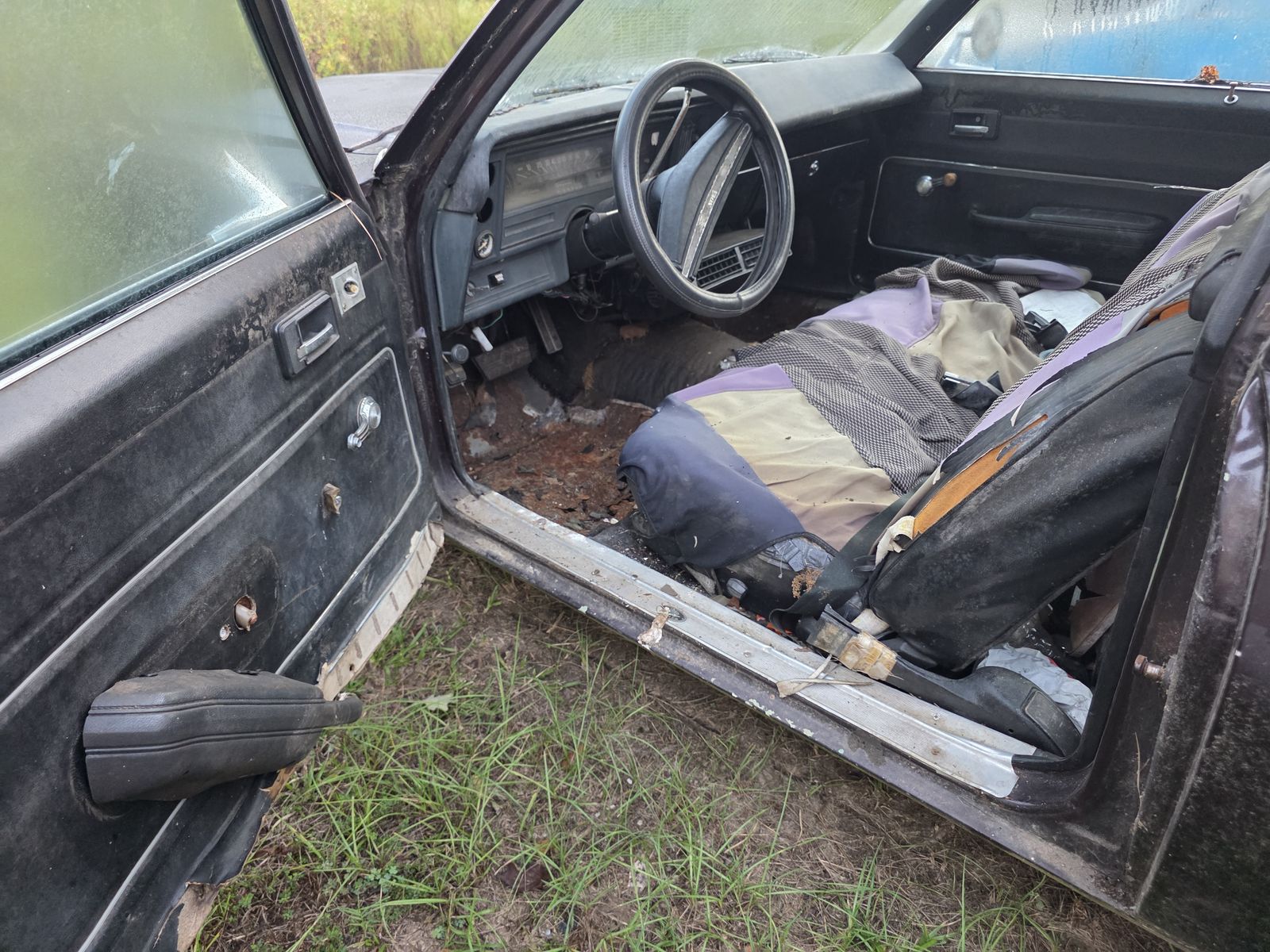 Nova driver footwell with the floor pan rusted through